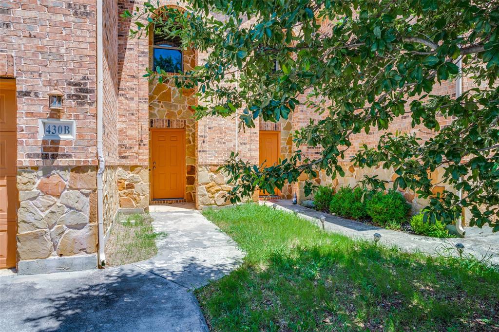 430 Woodgrove Drive, Unit A & B Little Elm, TX 75068 - Photo 2 of 20 a view of a pathway both side of house