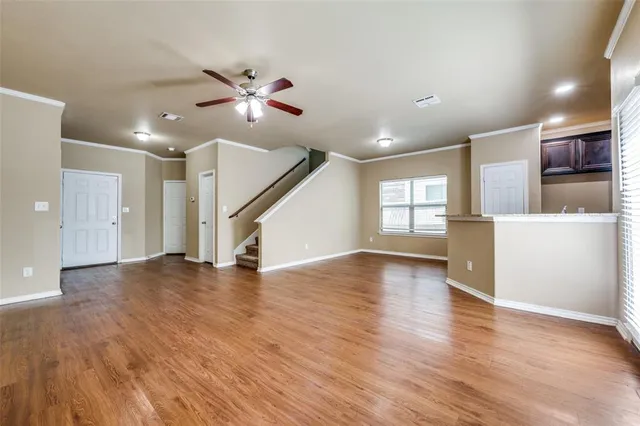 a kitchen with granite countertop stainless steel appliances a sink stove and cabinets