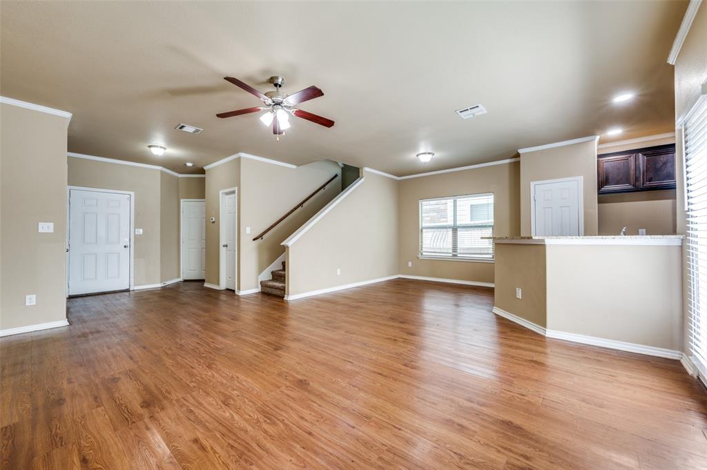430 Woodgrove Drive, Unit A & B Little Elm, TX 75068 - Photo 7 of 20 a view of an empty room with wooden floor and a window