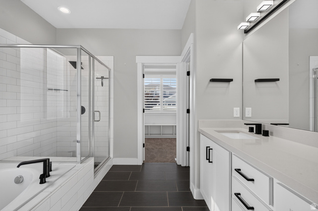 36 West Syracuse Road Vineyard, UT 84059 - Photo 28 of 56 Modern bathroom featuring a double vanity with white cabinetry, light countertops, and matte black fixtures