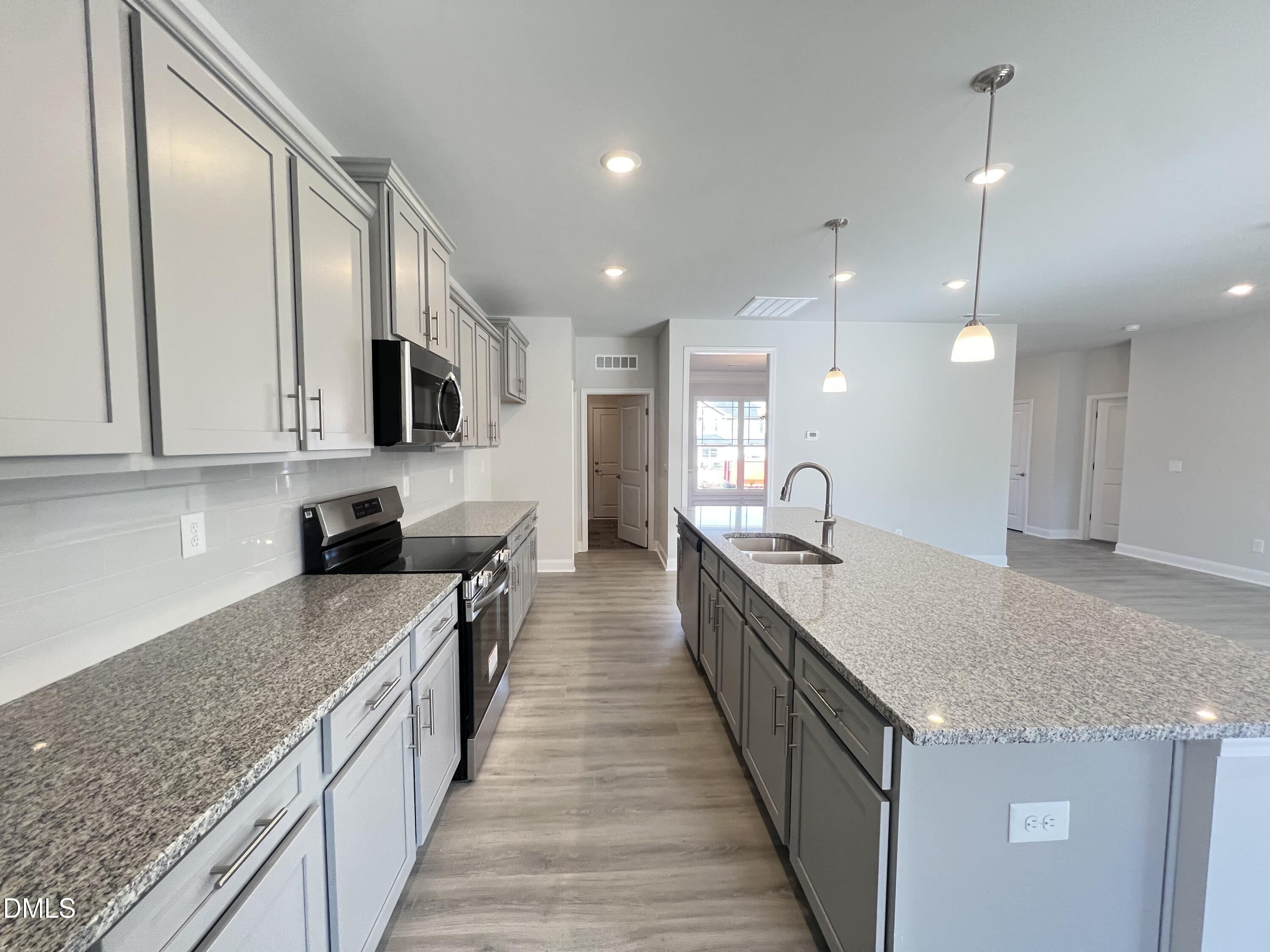 4009 Fletcher Road Bailey, NC 27807 - Photo 11 of 38 a large kitchen with stainless steel appliances