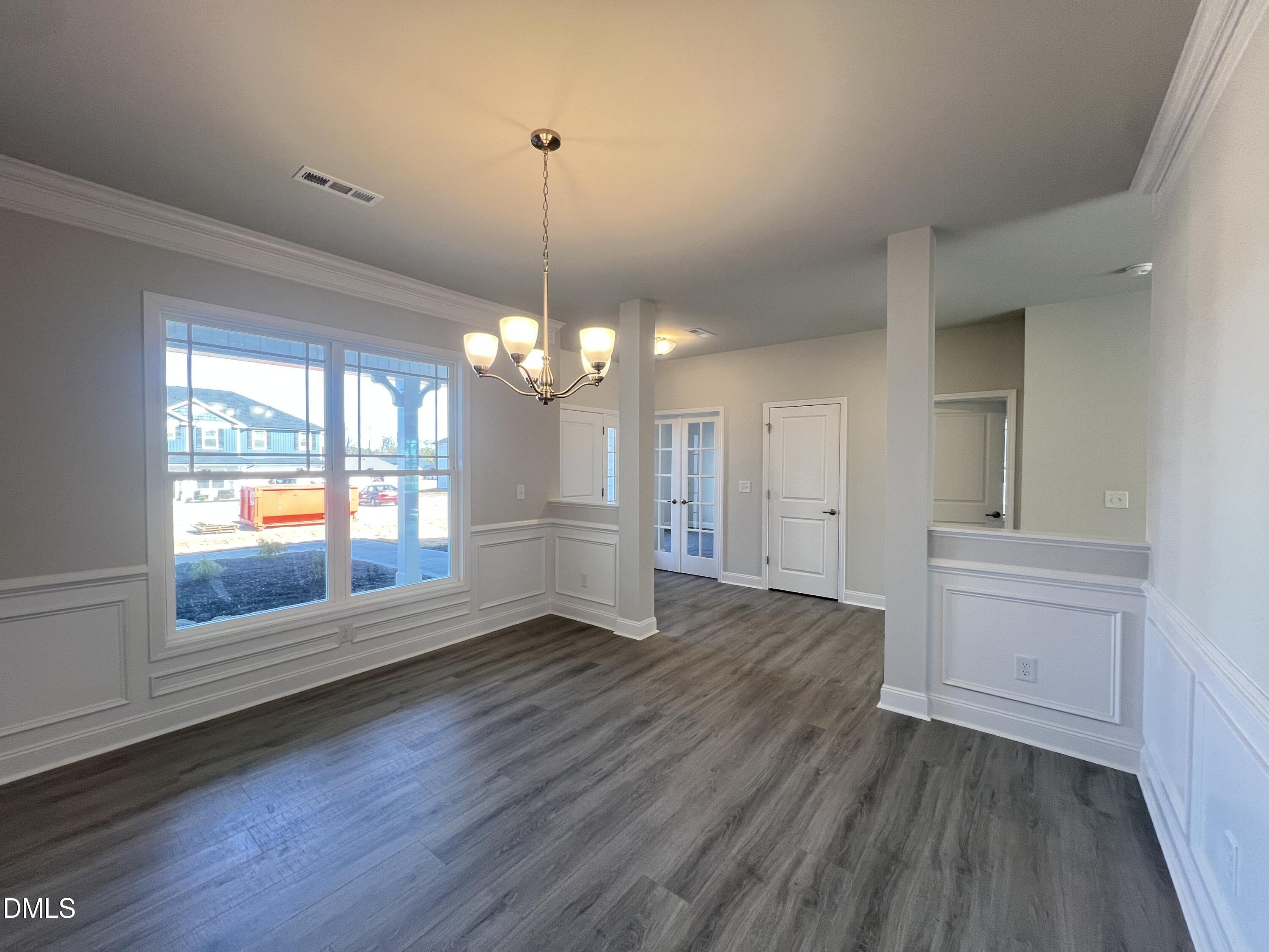 4009 Fletcher Road Bailey, NC 27807 - Photo 12 of 38 a view of an empty room with wooden floor and a window