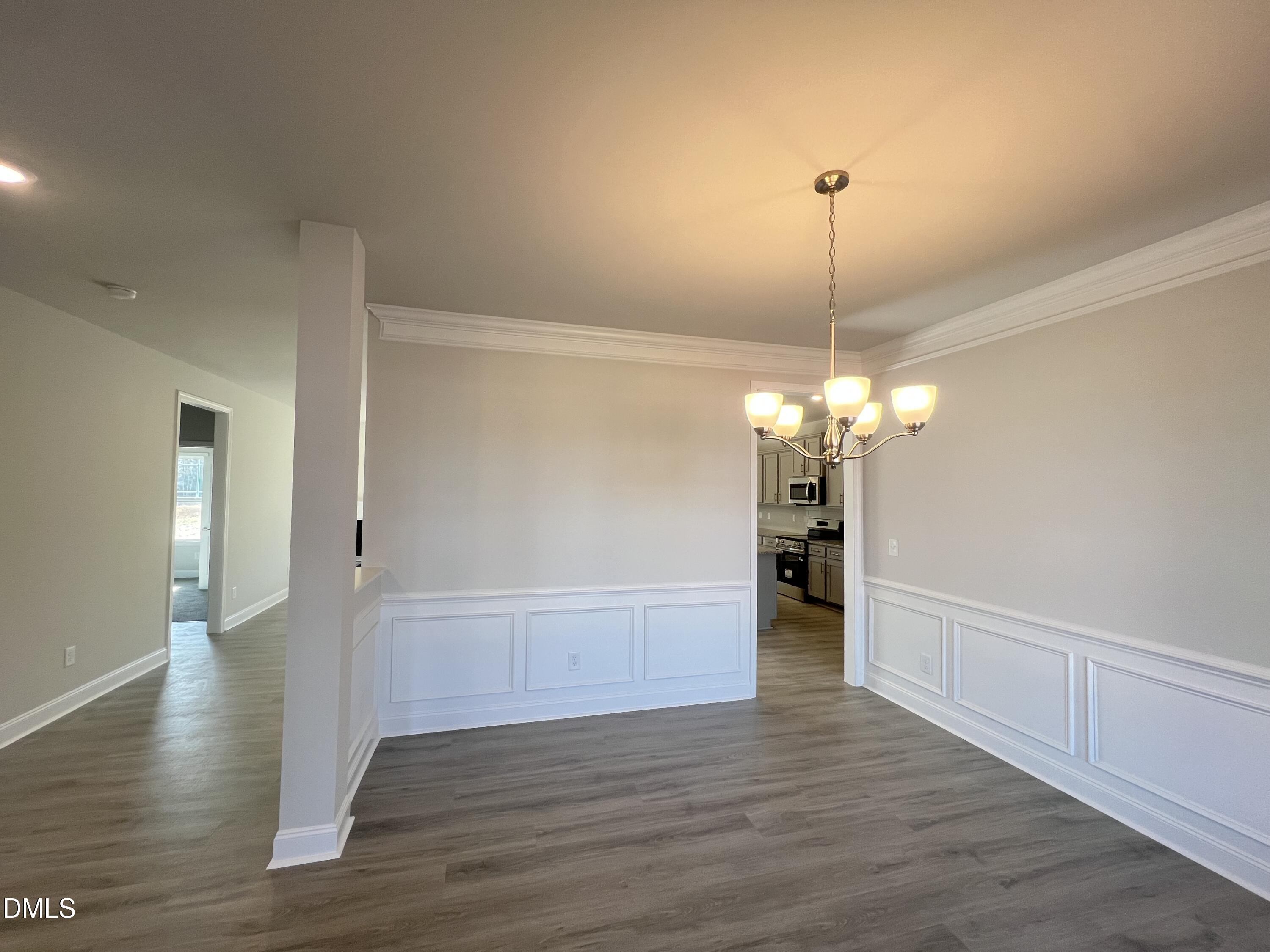 4009 Fletcher Road Bailey, NC 27807 - Photo 6 of 38 a view of a livingroom with a chandelier wooden floor and a chandelier