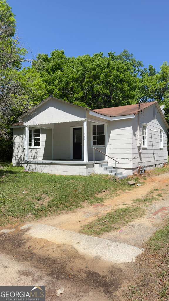 569 Grenada Terrace Macon, GA 31206 - Photo 1 of 1 a front view of a house with a garden and yard