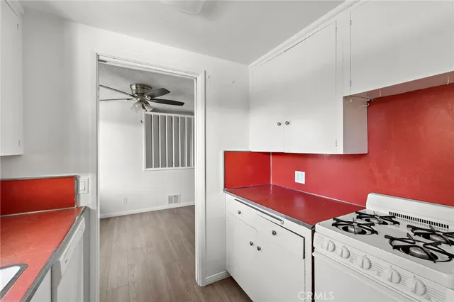 a kitchen with stainless steel appliances a stove and a refrigerator