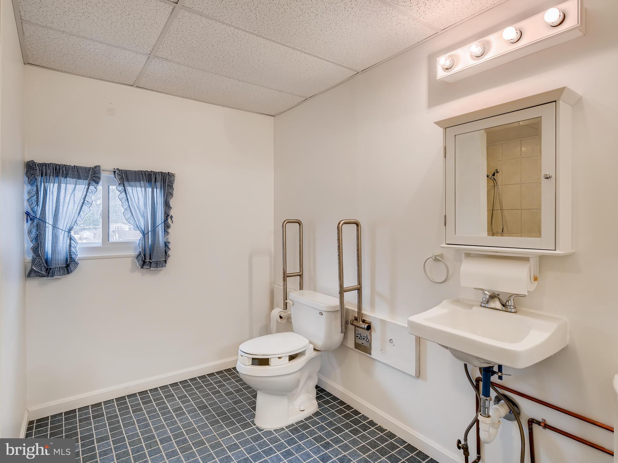 9617 Trepid Road Baltimore, MD 21236 - Photo 22 of 28 ACCESSIBLE BATHROOM, PART OF GARAGE CONVERSION