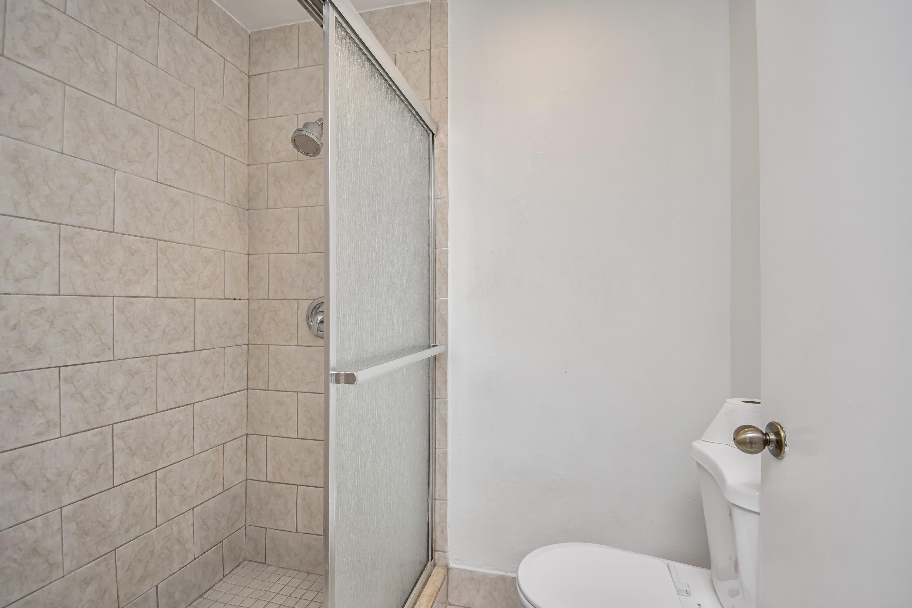 6825 Bridlewood Court Boca Raton, FL 33433 - Photo 20 of 31 a bathroom with a toilet and a shower