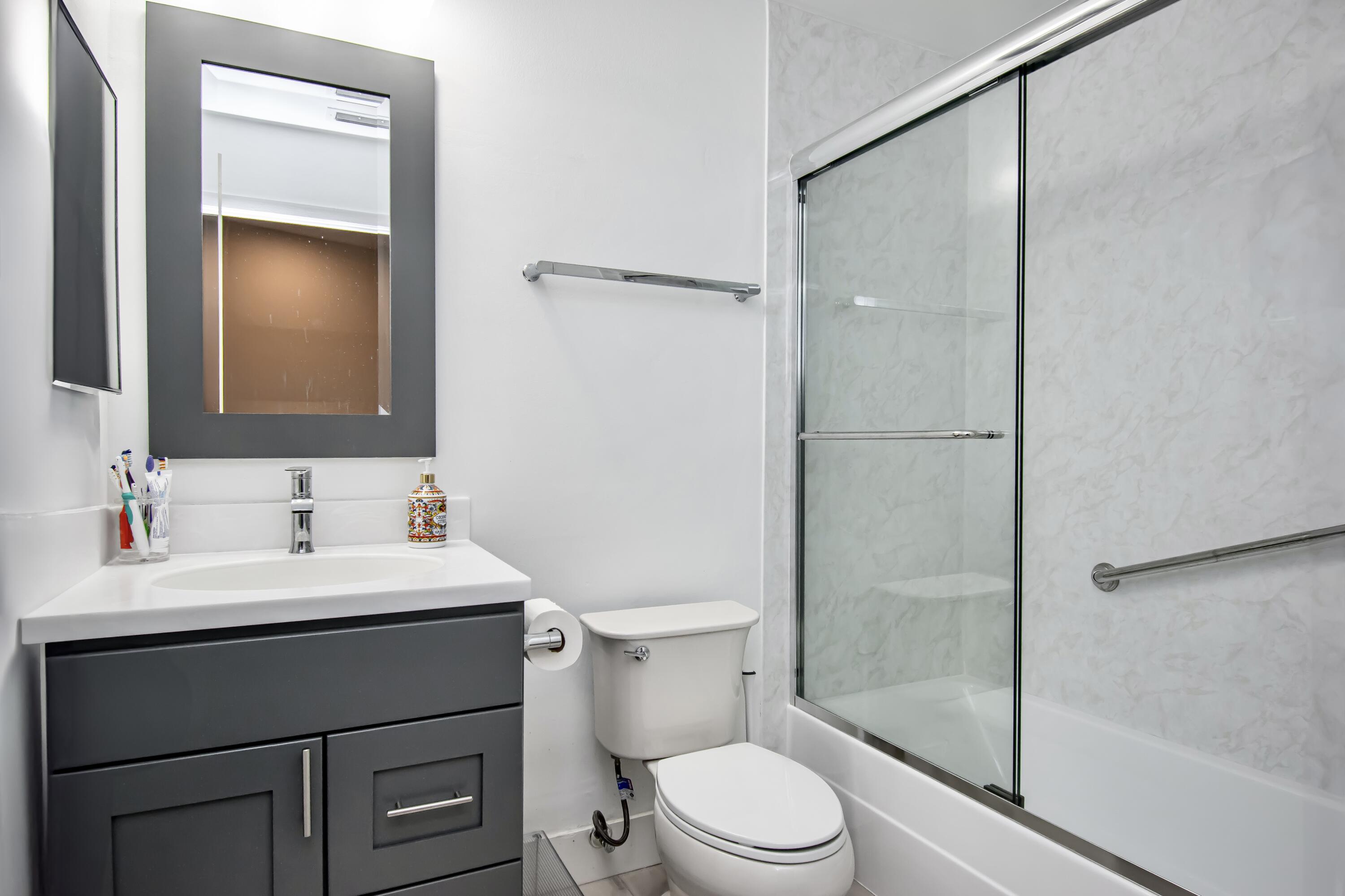 6825 Bridlewood Court Boca Raton, FL 33433 - Photo 23 of 31 a bathroom with a sink a toilet and shower