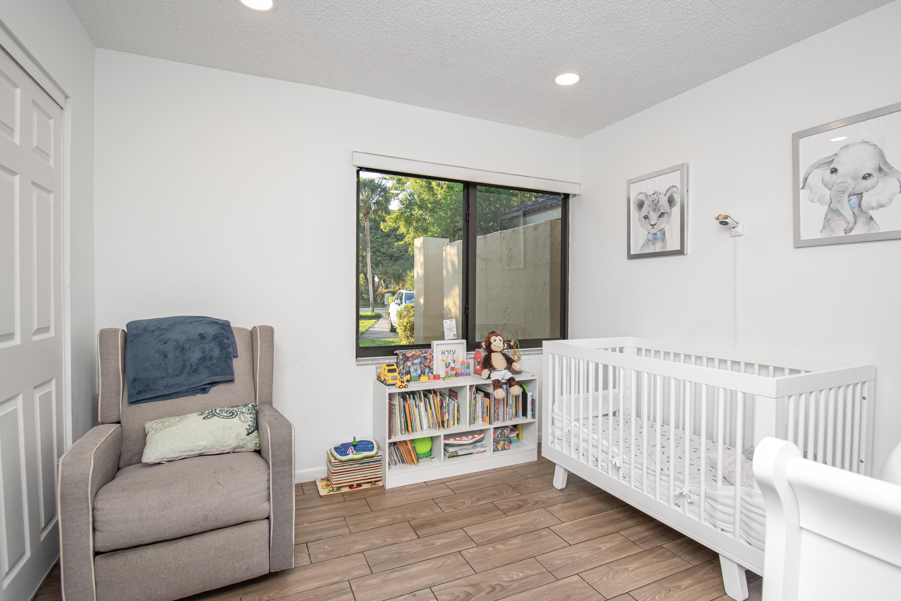 6825 Bridlewood Court Boca Raton, FL 33433 - Photo 25 of 31 a living room with furniture and a large window
