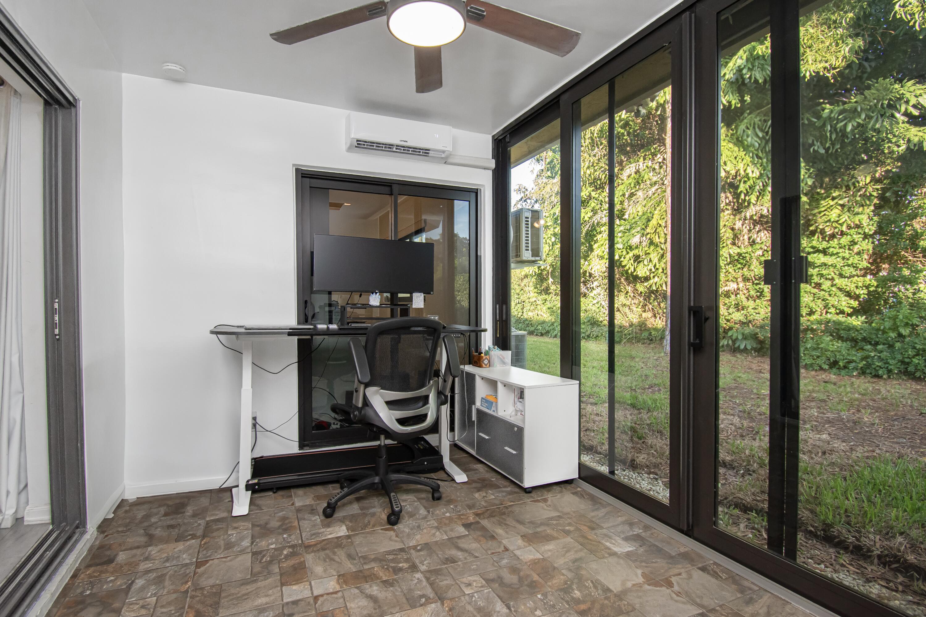6825 Bridlewood Court Boca Raton, FL 33433 - Photo 28 of 31 a view of a workspace with furniture and a window
