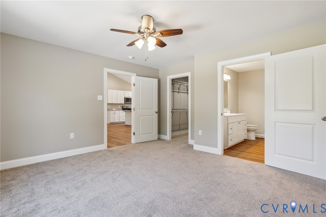 527 Salem Church Road Cumberland, VA 23040 - Photo 17 of 33 an empty room with closet and a chandelier fan