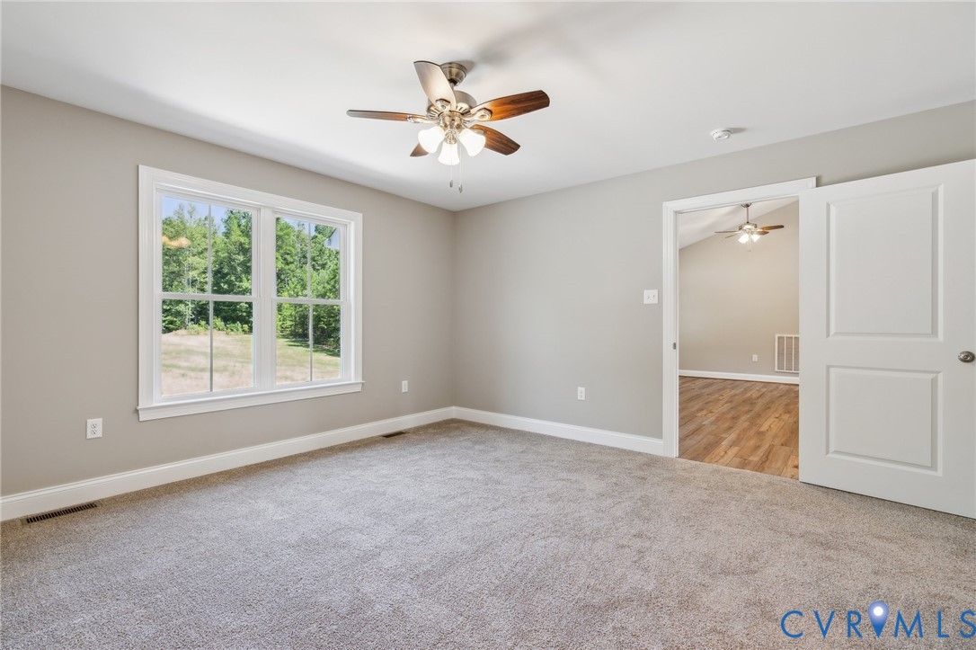 527 Salem Church Road Cumberland, VA 23040 - Photo 18 of 33 an empty room with ceiling fan and window