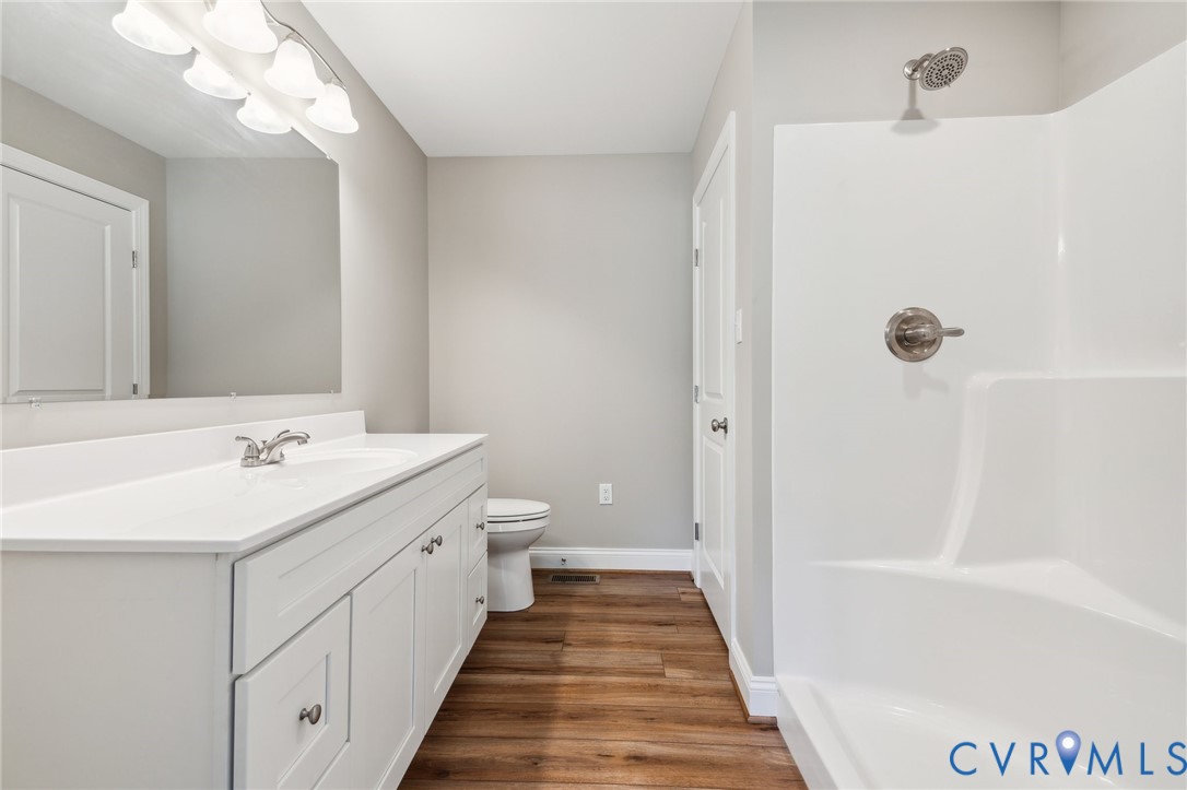 527 Salem Church Road Cumberland, VA 23040 - Photo 19 of 33 a bathroom with a sink a mirror and a shower