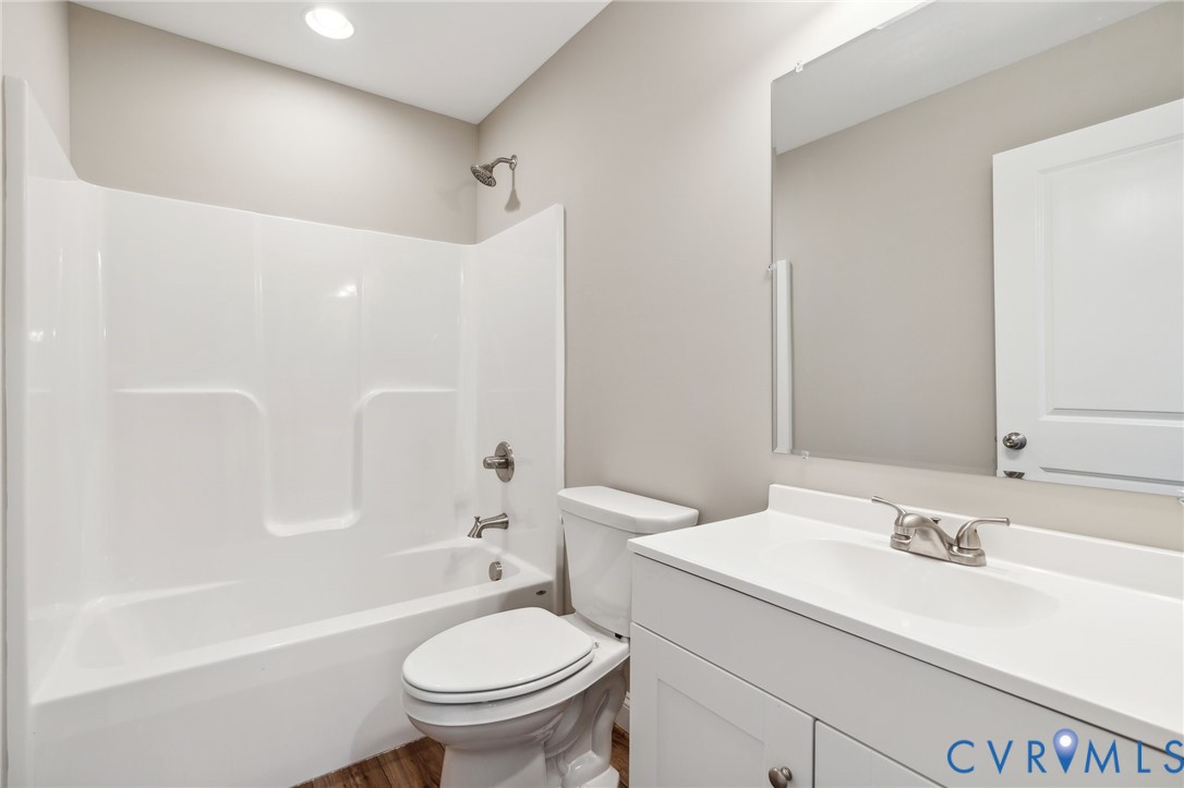 527 Salem Church Road Cumberland, VA 23040 - Photo 25 of 33 a bathroom with a sink toilet vanity and shower