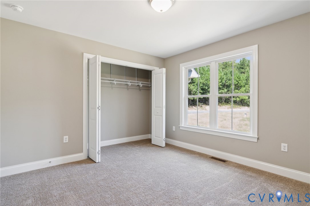 527 Salem Church Road Cumberland, VA 23040 - Photo 27 of 33 an empty room with windows and closet