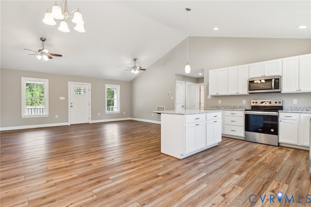 527 Salem Church Road Cumberland, VA 23040 - Photo 6 of 33 a kitchen with stainless steel appliances granite countertop a stove top oven a sink dishwasher and a oven with wooden floors