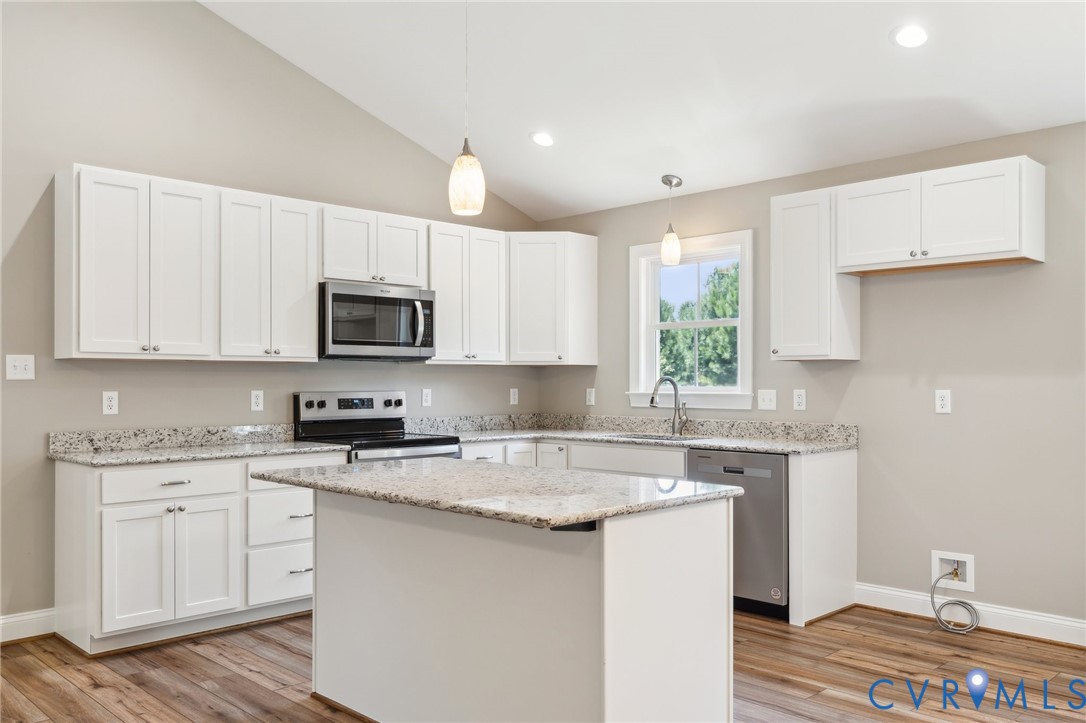 527 Salem Church Road Cumberland, VA 23040 - Photo 10 of 33 a kitchen with granite countertop white cabinets and white appliances