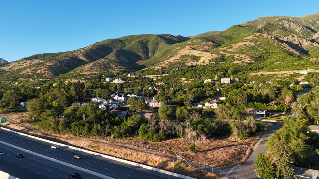 1792 Valley View Drive Layton, UT 84040 - Photo 11 of 18 Mountainous terrain and lush green vegetation form a natural backdrop for the residential area