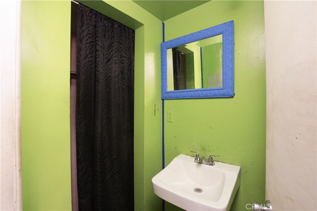 8949 Atlantic Avenue South Gate, CA 90280 - Photo 12 of 43 a bathroom with a sink and a mirror