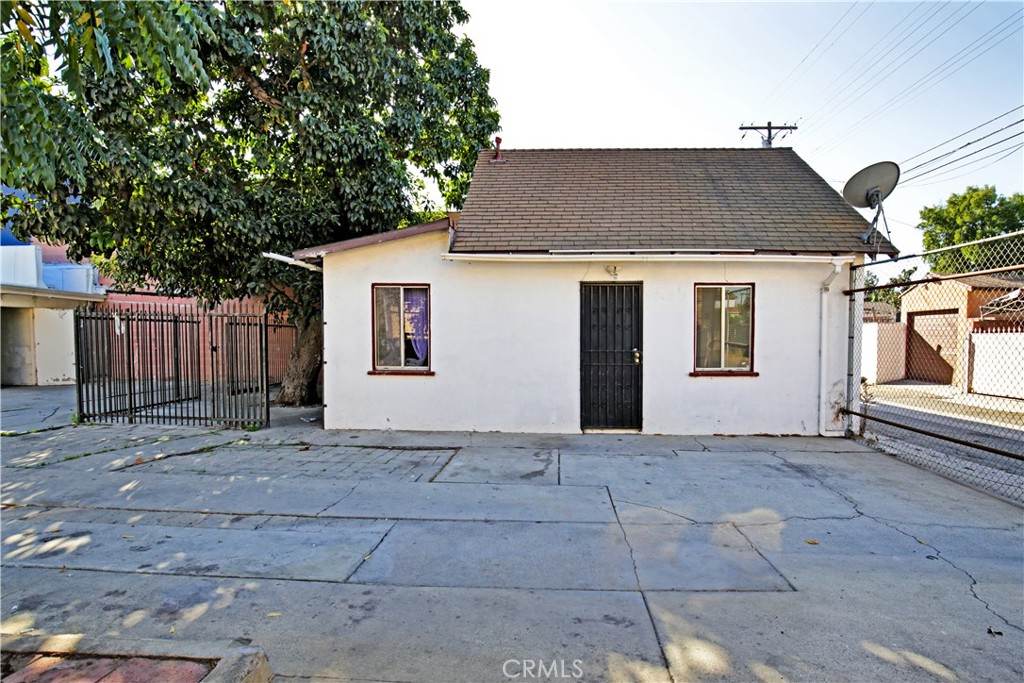 8949 Atlantic Avenue South Gate, CA 90280 - Photo 20 of 43 a front view of a house with a garage