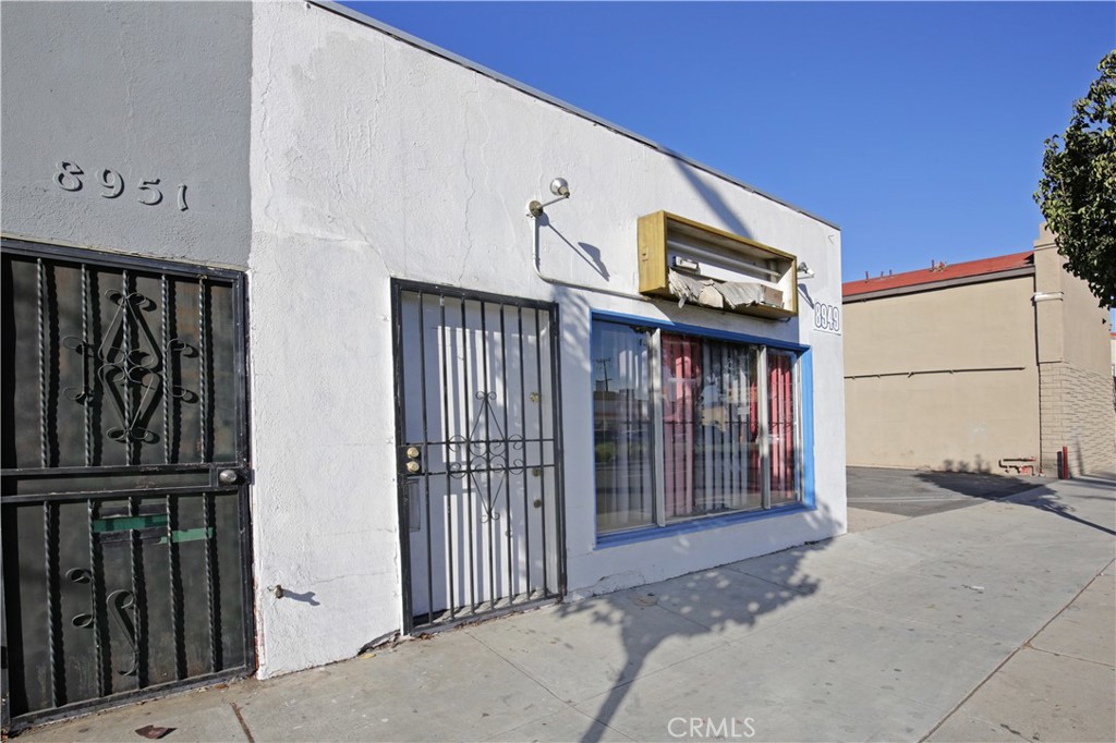 8949 Atlantic Avenue South Gate, CA 90280 - Photo 2 of 43 a view of a house with iron stairs