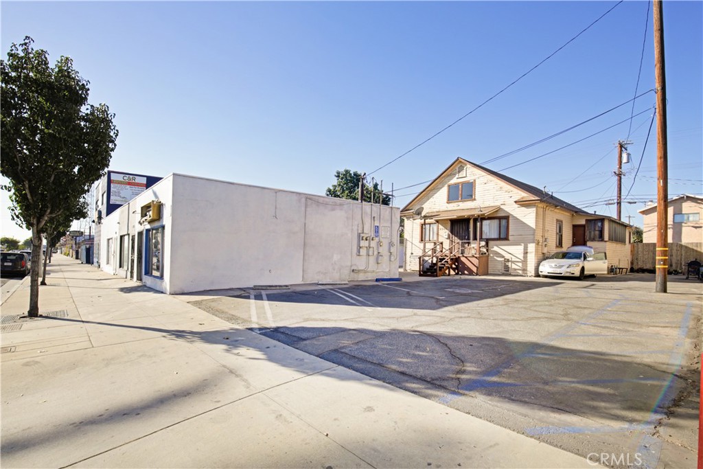 8949 Atlantic Avenue South Gate, CA 90280 - Photo 34 of 43 a front view of a house with a yard and garage