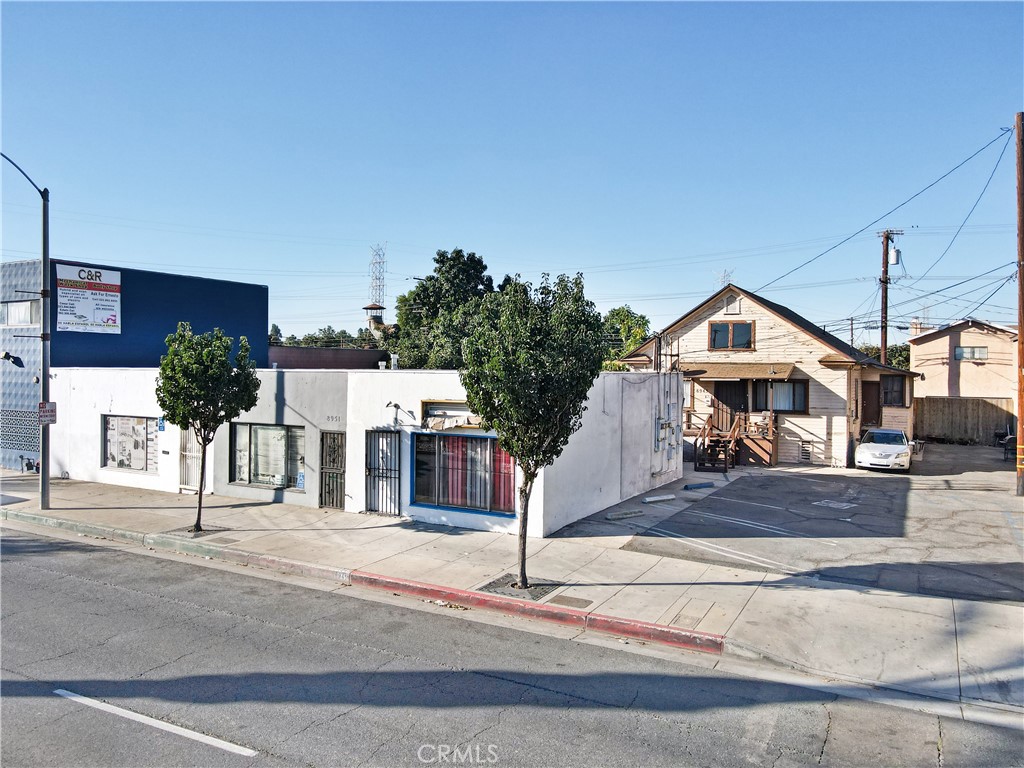 8949 Atlantic Avenue South Gate, CA 90280 - Photo 37 of 43 a front view of a house with a yard