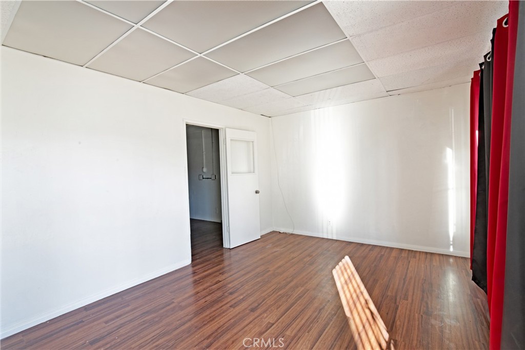8949 Atlantic Avenue South Gate, CA 90280 - Photo 5 of 43 a view of an empty room with wooden floor