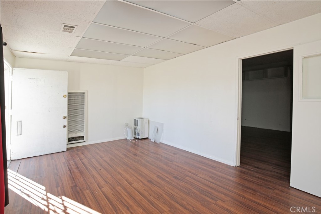 8949 Atlantic Avenue South Gate, CA 90280 - Photo 6 of 43 a view of an empty room with wooden floor