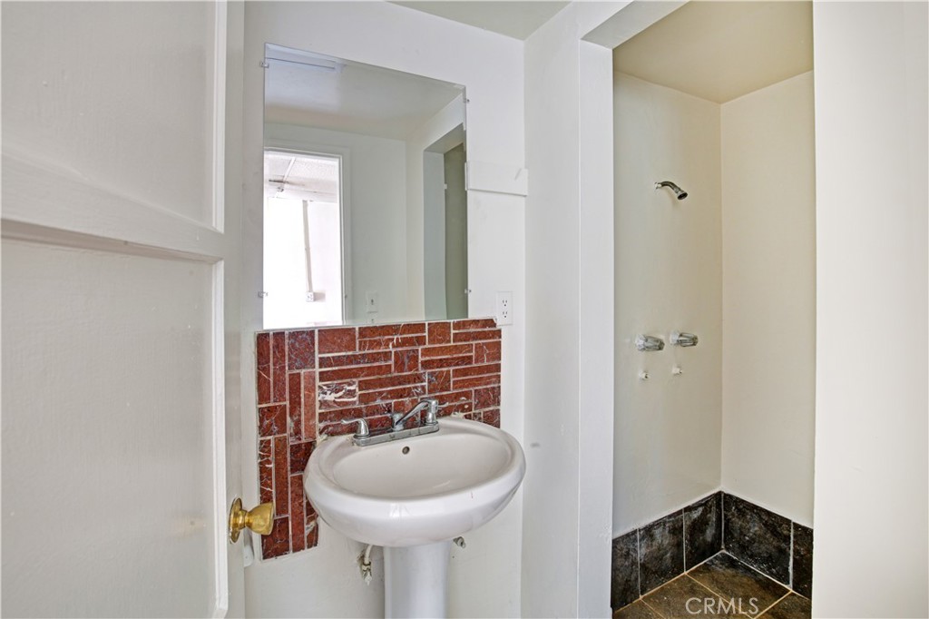 8949 Atlantic Avenue South Gate, CA 90280 - Photo 8 of 43 a bathroom with a sink and a mirror