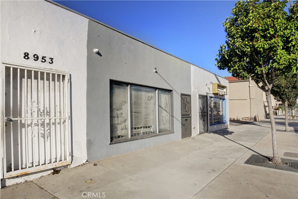 8949 Atlantic Avenue South Gate, CA 90280 - Photo 9 of 43 a view of a house with a patio