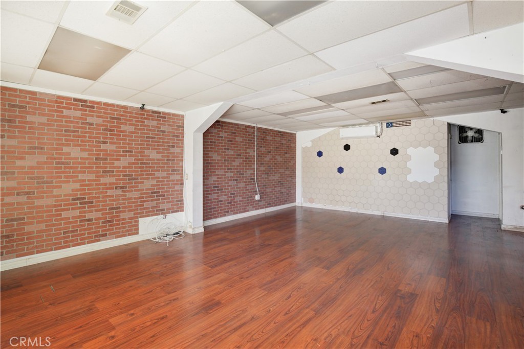 8949 Atlantic Avenue South Gate, CA 90280 - Photo 10 of 43 a view of an empty room with wooden floor