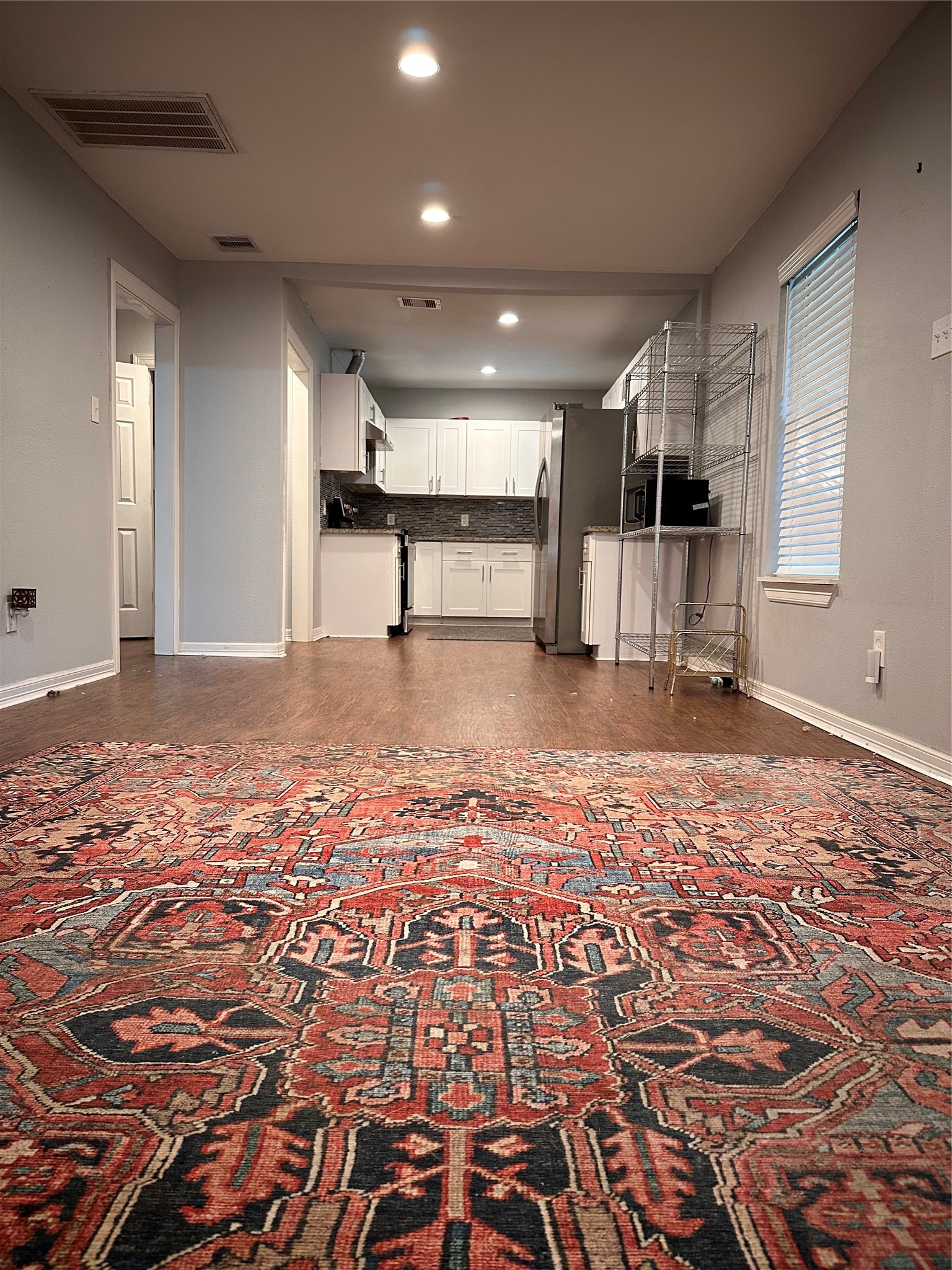 4802 Eppes Street Houston, TX 77021 - Photo 6 of 34 an empty room with wooden floor and windows