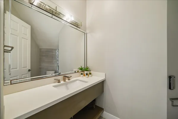 a bathroom with a sink and a mirror