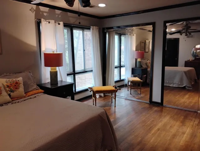 a bedroom with a bed and a couch