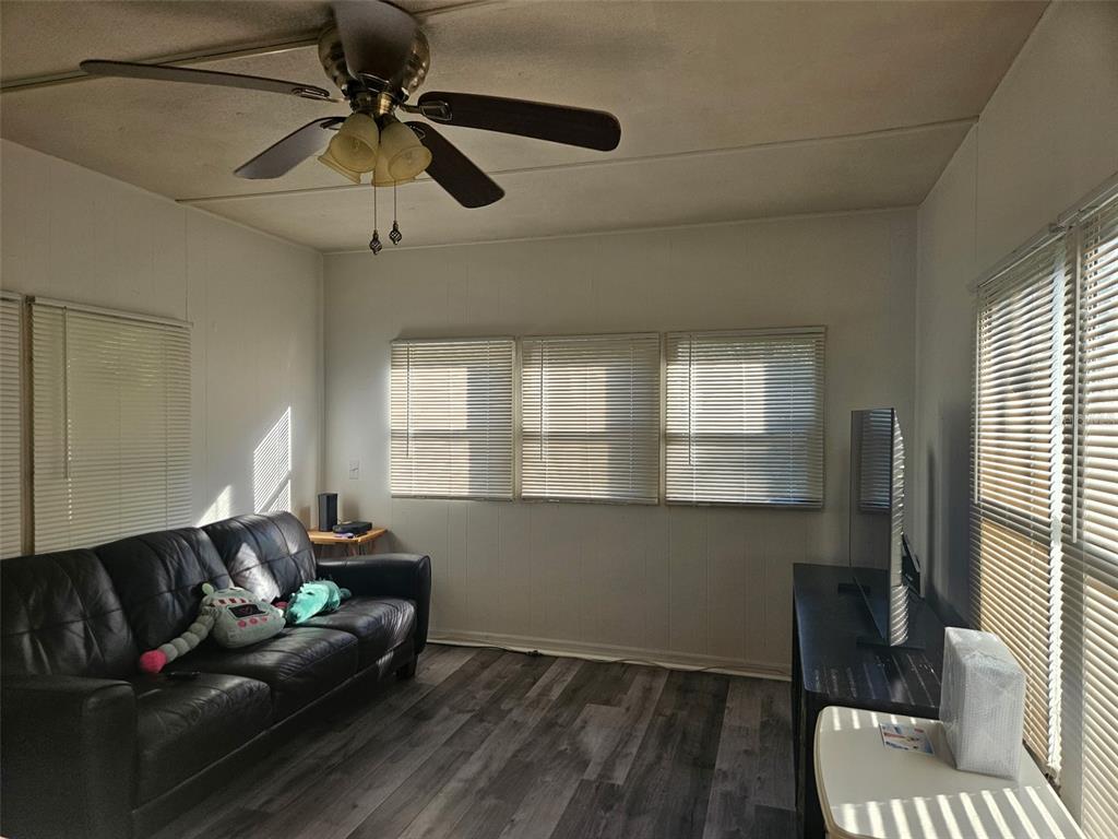 8603 Alafia Ridge Road Riverview, FL 33569 - Photo 11 of 13 a living room with furniture and a window