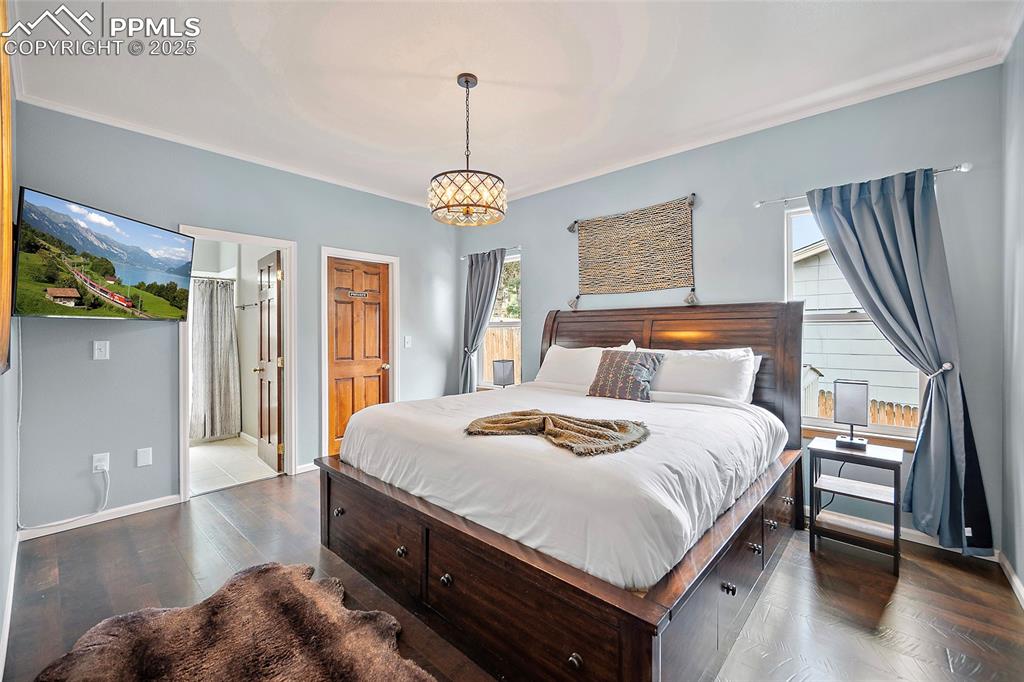 9845 Mesa Road Cascade, CO 80809 - Photo 14 of 50 a bedroom with bed and window