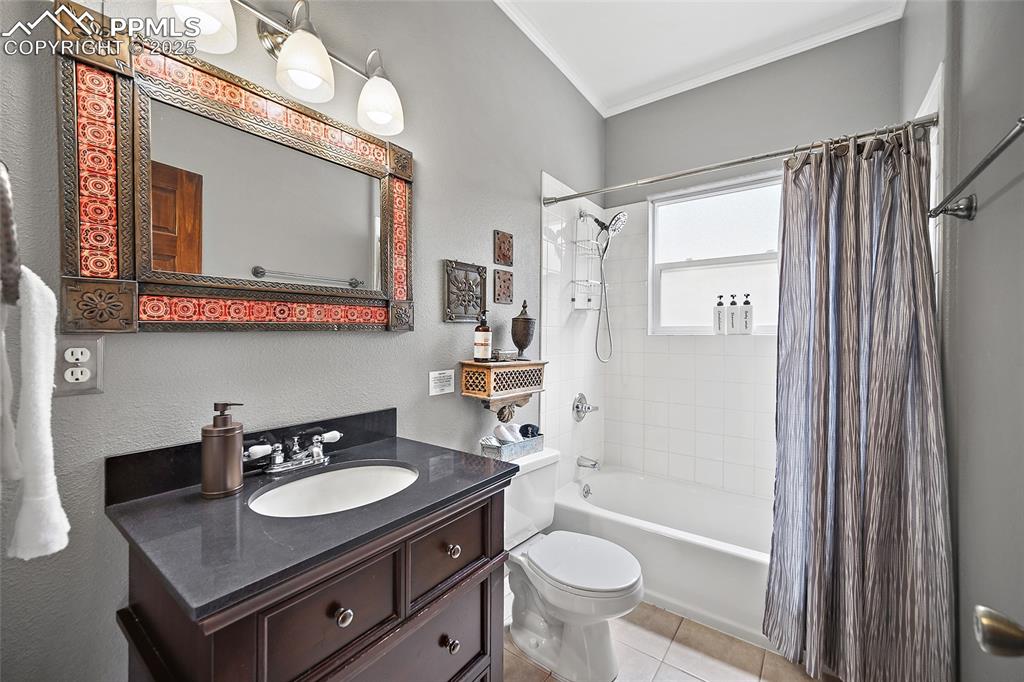 9845 Mesa Road Cascade, CO 80809 - Photo 15 of 50 a bathroom with a sink a toilet a mirror and shower