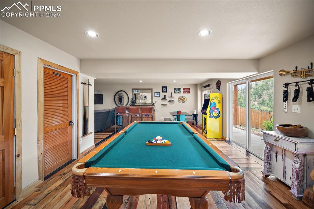 9845 Mesa Road Cascade, CO 80809 - Photo 21 of 50 a room with pool table and flat screen tv
