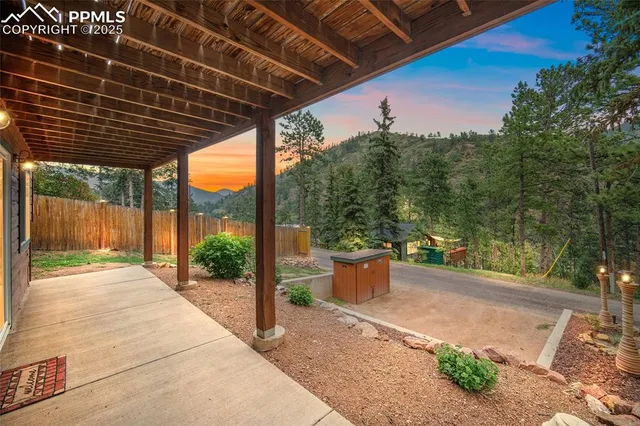 a backyard of a house with fountain and outdoor seating