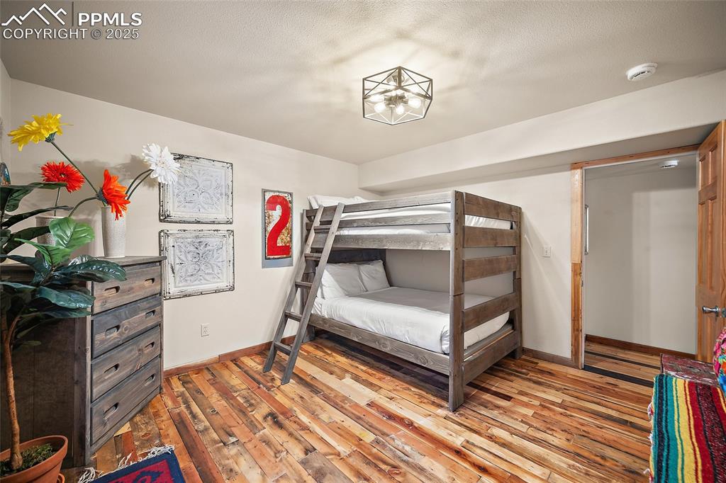9845 Mesa Road Cascade, CO 80809 - Photo 26 of 50 a bedroom with a bed and a window