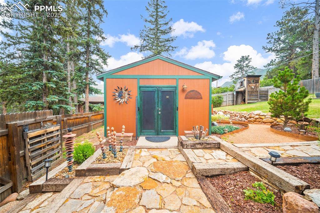 9845 Mesa Road Cascade, CO 80809 - Photo 34 of 50 a front view of a house with a yard