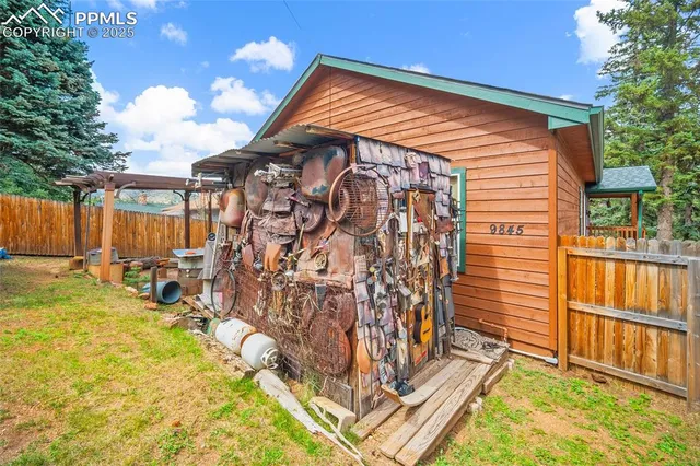 a backyard of a house with table and chairs