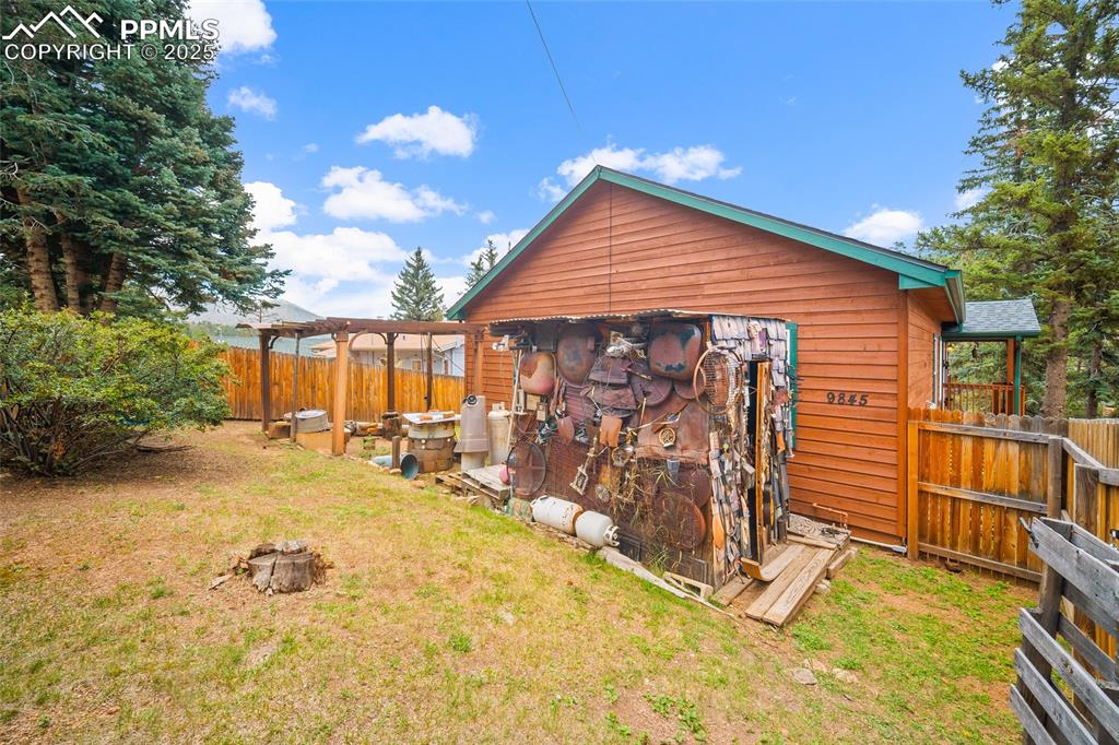 9845 Mesa Road Cascade, CO 80809 - Photo 38 of 50 a view of a house with a patio
