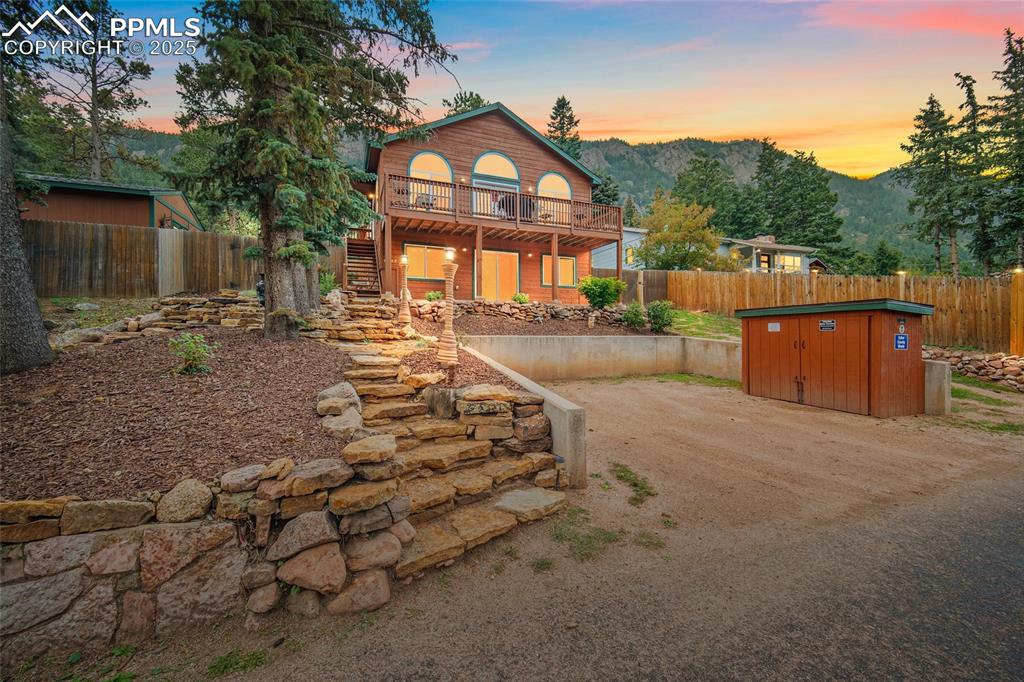 9845 Mesa Road Cascade, CO 80809 - Photo 40 of 50 a view of a house with a yard