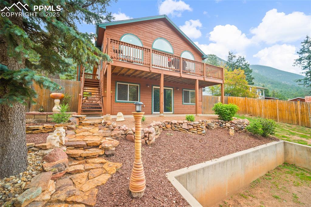 9845 Mesa Road Cascade, CO 80809 - Photo 50 of 50 a view of a house with a yard