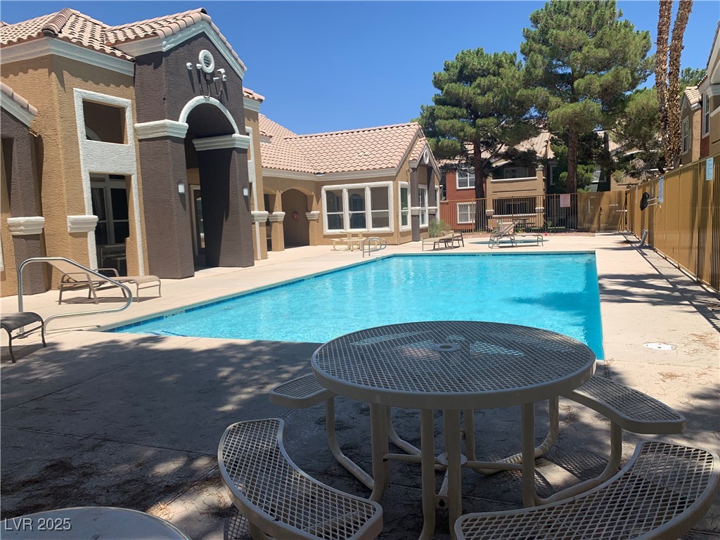 8101 West Flamingo Road, Unit 1102 Las Vegas, NV 89147 - Photo 3 of 54 Community pool with a patio area