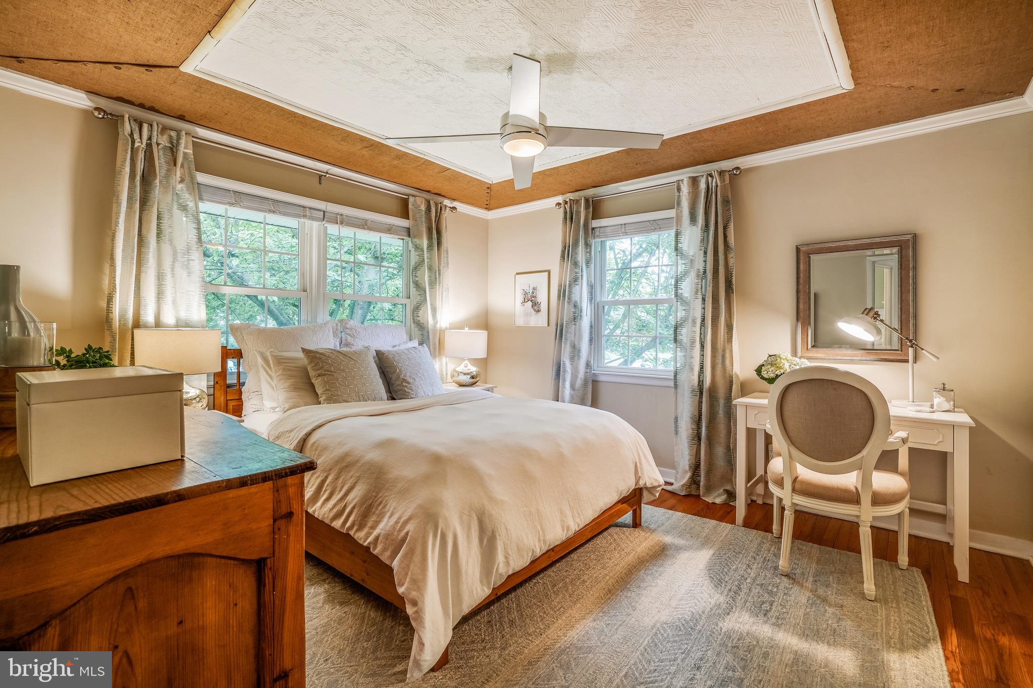 202 Burd Street Pennington, NJ 08534 - Photo 13 of 30 a bedroom with a bed and dresser with wooden floor
