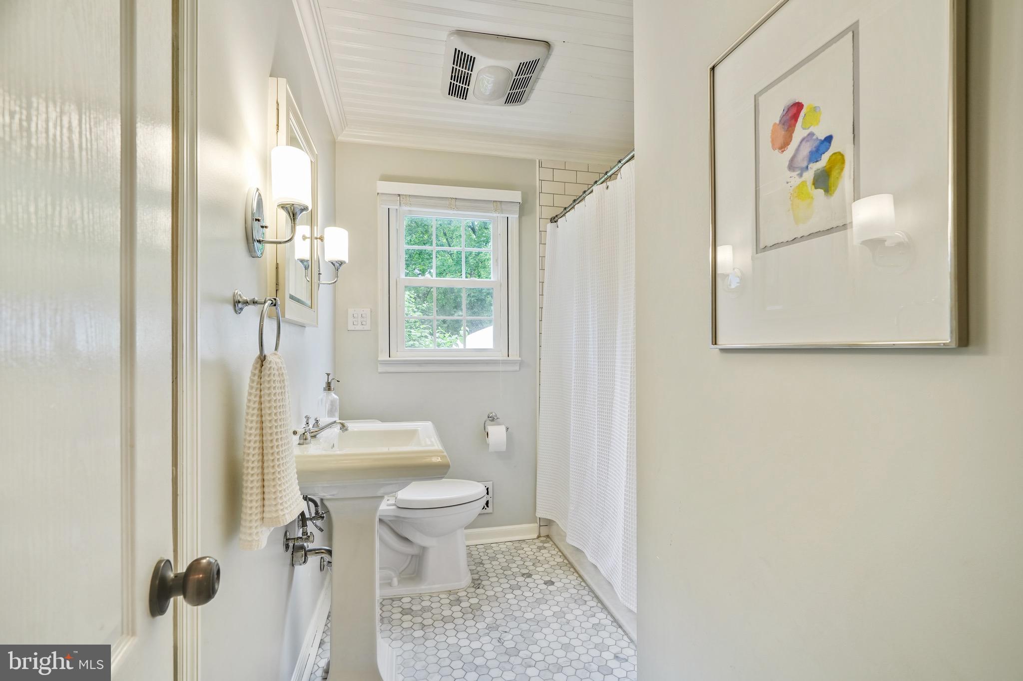 202 Burd Street Pennington, NJ 08534 - Photo 18 of 30 a bathroom with a sink toilet and window