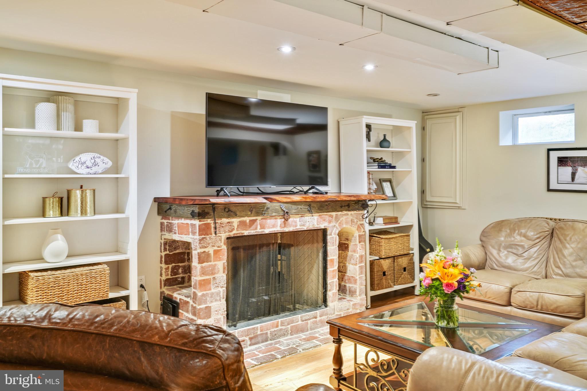 202 Burd Street Pennington, NJ 08534 - Photo 22 of 30 a living room with furniture and a fireplace